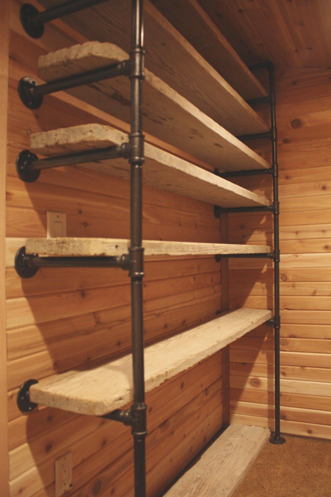 Pipes and reclaimed wood turned into closet shelves