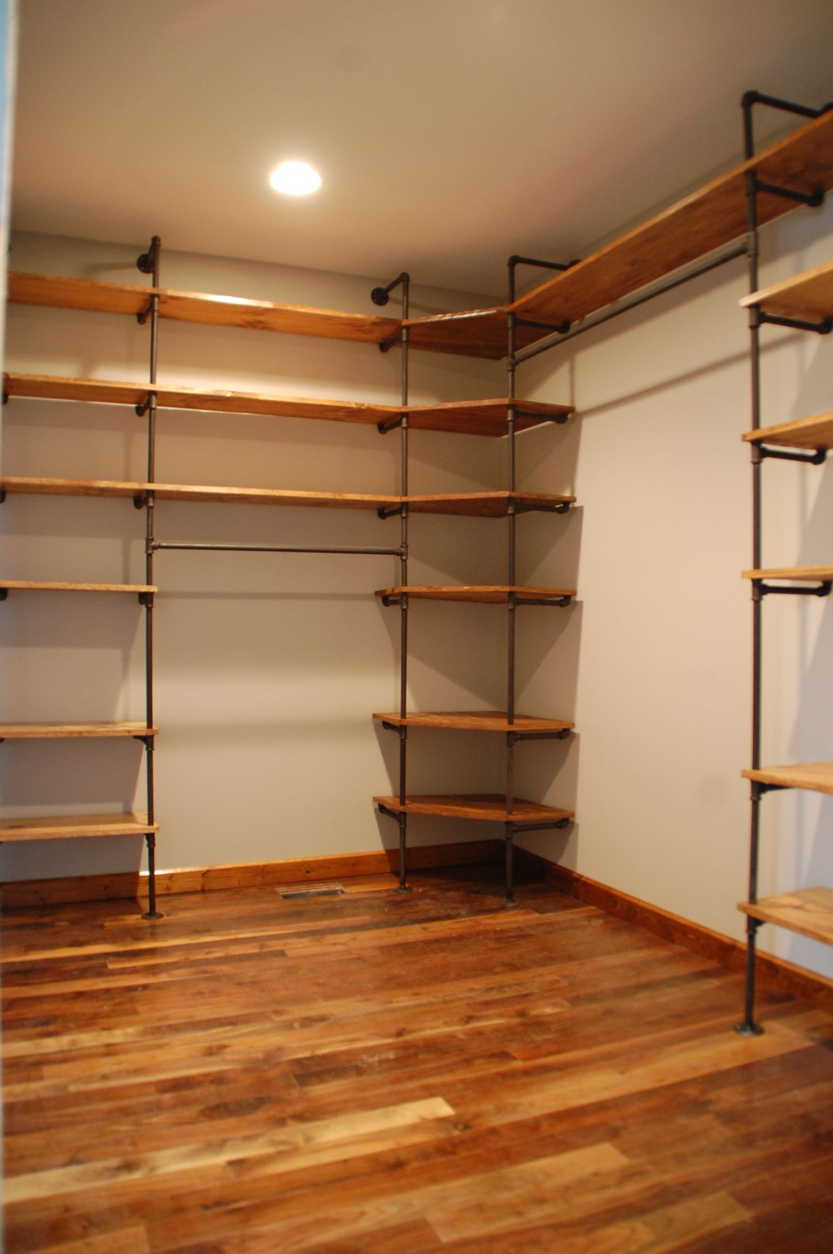 Pipes and wood closet shelves
