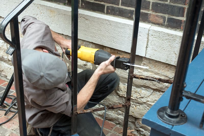 Worker Using Reciprocating Saw